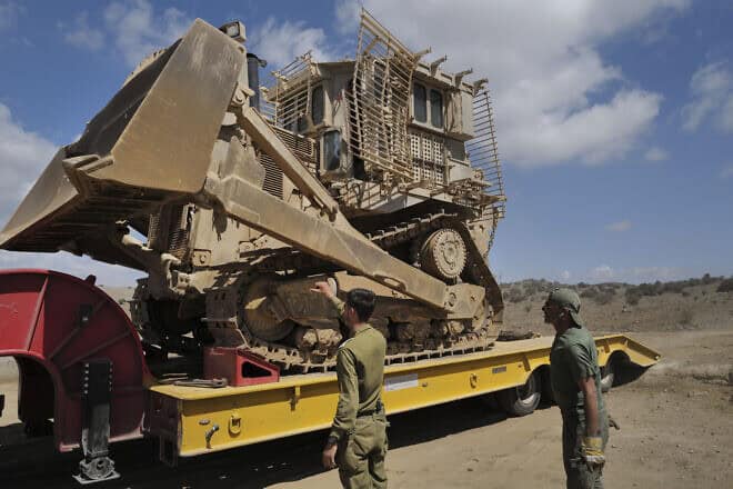 IDF Engineering Corps troops moving an IDF Caterpillar D-9 armored bulldozer, in the northern Golan Heights, on Sept. 19, 2024. Photo by Michael Giladi/Flash90.