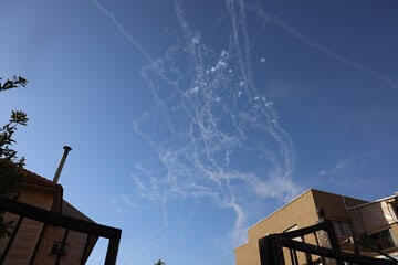 Israeli aerial defense systems intercept Hezbollah rockets over the Upper Galilee, as seen from Safed, Oct. 9, 2024. Photo by David Cohen/Flash90.