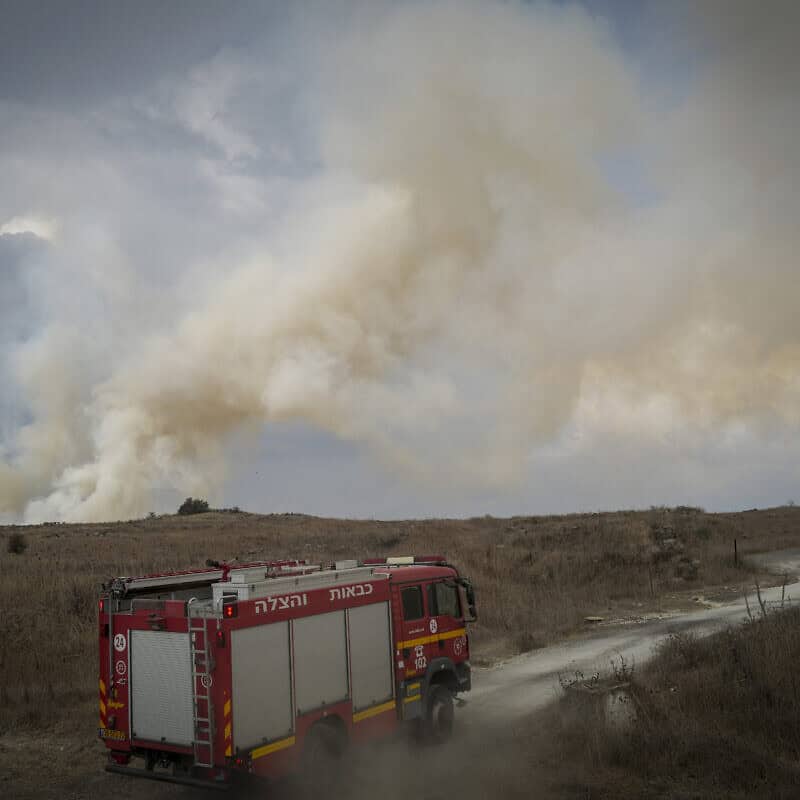 Firefighters combat wildfires following a 25-missile barrage on the northern town of Katzrin and central Golan Heights, Nov. 3, 2024. Photo by Michael Giladi/ Flash90.