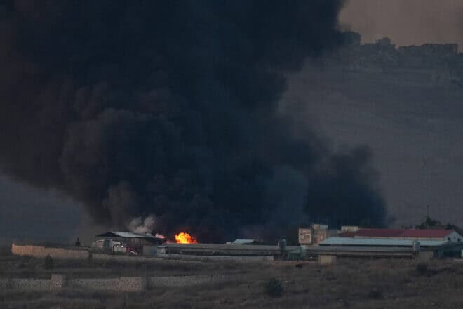 Smoke rises from a large fire after missiles launched from Lebanon hit Moshav Avivim, near the Israeli border with Lebanon, Nov. 6, 2024. Photo by Ayal Margolin/Flash90.
