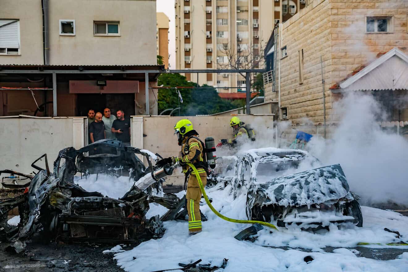 Rescue personnel at the site where a missile fired from Lebanon hit cars and caused damage in Kiryat Yam, northern Israel, on Nov. 7, 2024. Photo by David Cohen/Flash90.