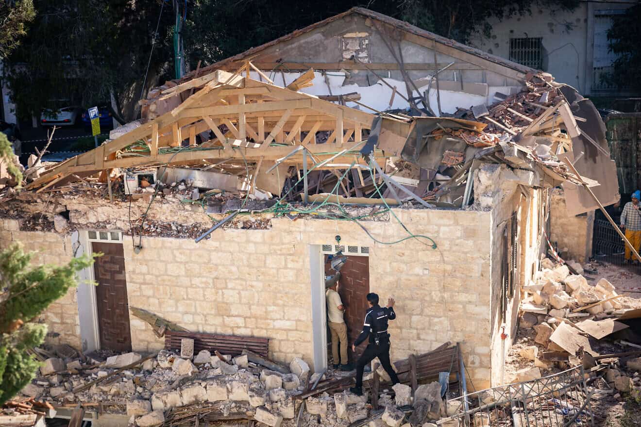 Damage caused to vehicles and buildings in Haifa from a missile fired from Lebanon, Nov. 17, 2024. Photo by Yonatan Sindel/Flash90.