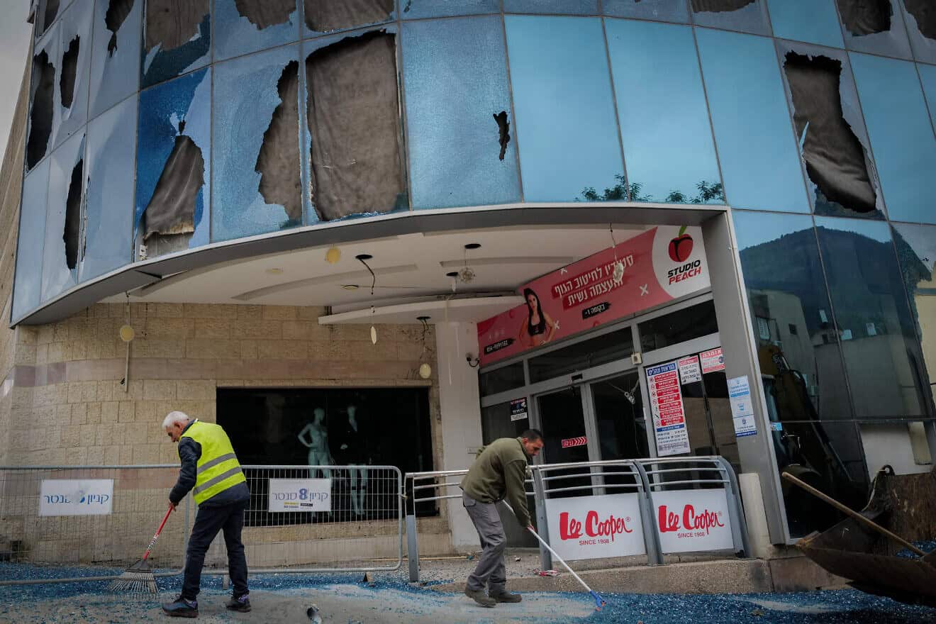Residents of Kiryat Shmona check last night's missile-attack damage at the city's central bus station and mall on Nov. 27, 2024. Photo by Michael Giladi/Flash90.
