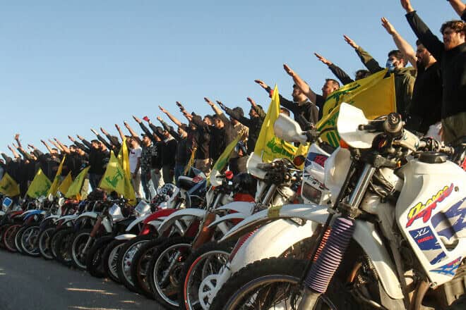 Hezbollah terrorists salute in Lebanon's Marjayoun District, near the border with Israel, May 25, 2020. Photo by Mahmoud Zayyat/AFP via Getty Images.
