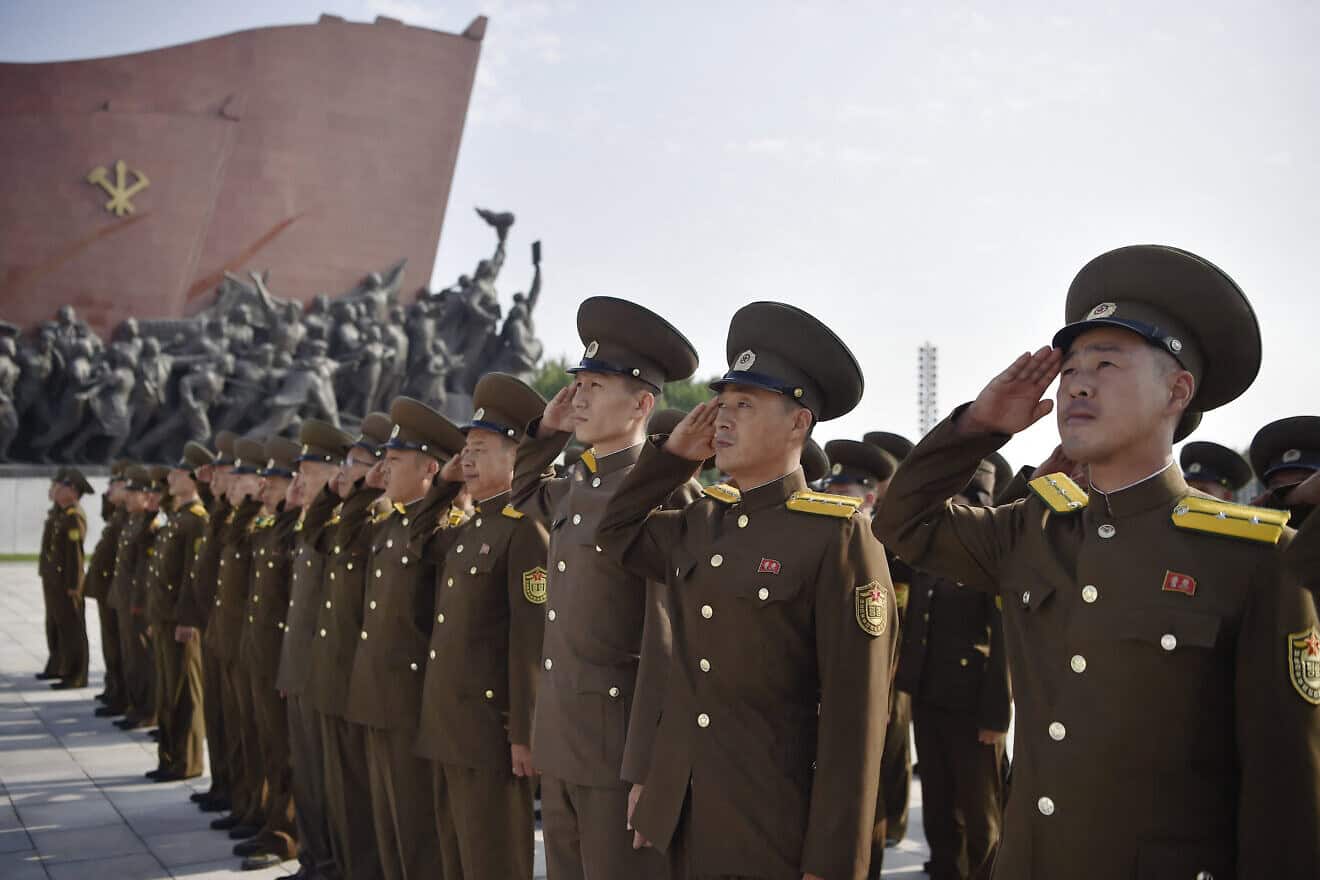 Service personnel of the Ministry of Public Security pay tribute as they visit the statues of late North Korean leaders Kim Il Sung and Kim Jong Il at Mansu Hill in Pyongyang on the occasion of the 76th founding anniversary of North Korea, on Sept. 9, 2024. Photo by Kim Won Jin/AFP via Getty Images.