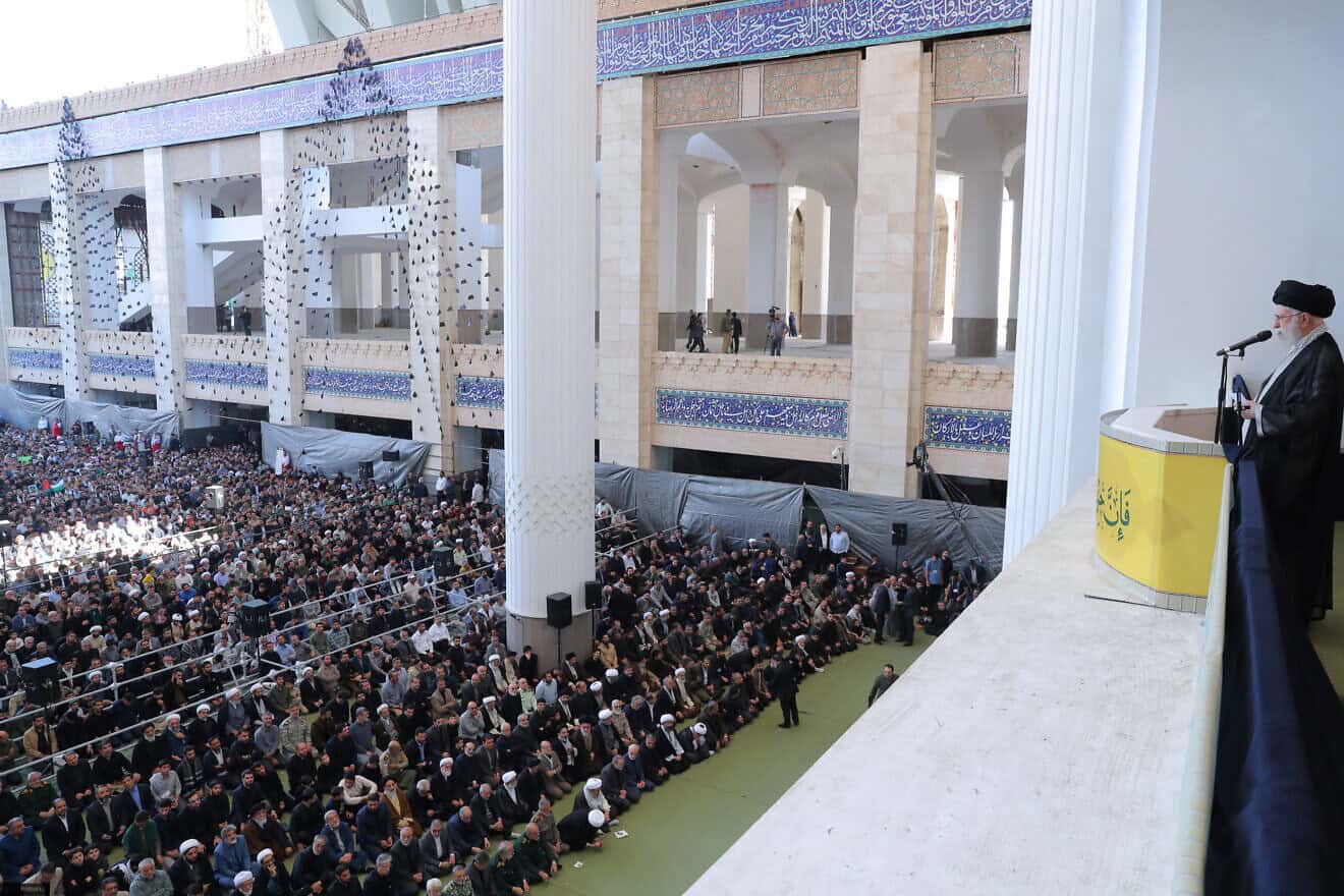 In this handout image provided by the Iranian Leader's Press Office, Iranian Supreme Leader Ayatollah Ali Khamenei stands with a rifle as he leads Friday prayers at the Imam Khomeini Musalla Mosque in Tehran, Iran, on Oct. 4, 2024. Photo by Iranian Leader's Press Office/Getty Images.
