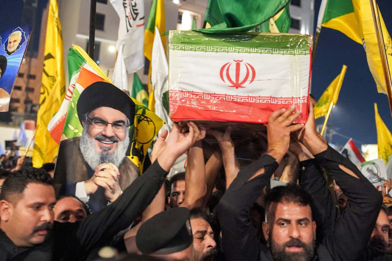 Mourners march with the body of slain Iranian Islamic Revolutionary Guard Corps commander Abbas Nilforoushan during his funeral in Najaf, Iraq, Oct. 14, 2024. Photo by Qassem Al-Kaabi/AFP via Getty Images.