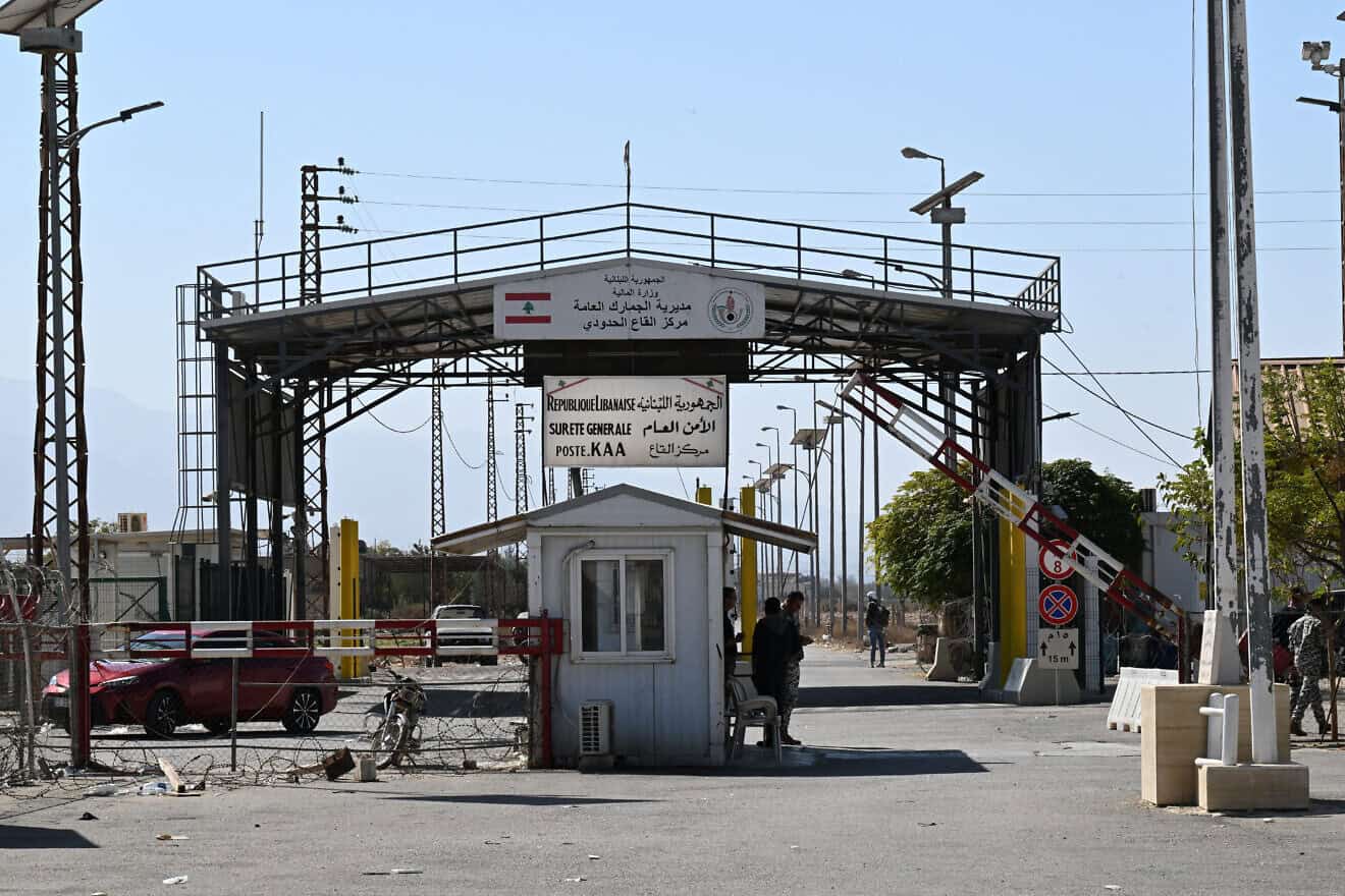 Lebanese government officials stand on Lebanon's Qaa side of Syria's Jousieh border crossing on Oct. 28, 2024. Photo by Louai Beshara/AFP via Getty Images.