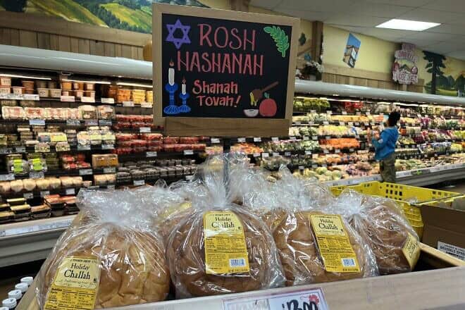 Display of holiday Challah bread with a Rosh Hashanah sign in the bakery section at Trader Joe's, Danville, Calif., Oct. 4, 2024. Photo by Smith Collection/Gado/Getty Images.