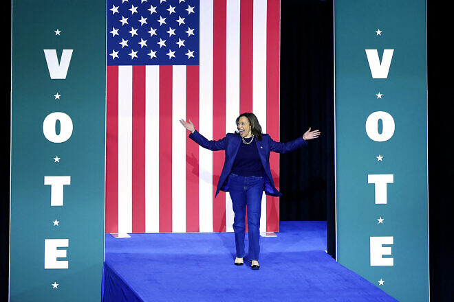 Vice President and Democratic presidential nominee Kamala Harris walks on stage as she arrives for a campaign rally at Michigan State University's Jenison Field House in East Lansing, Mich., on Nov. 3, 2024. Photo by Jeff Kowalsky/AFP via Getty Images.