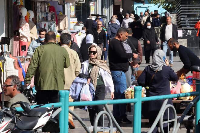 People walk through a shopping district in the Iranian capital Tehran on Nov. 6, 2024. Photo by Atta Kenare/AFP via Getty Images.