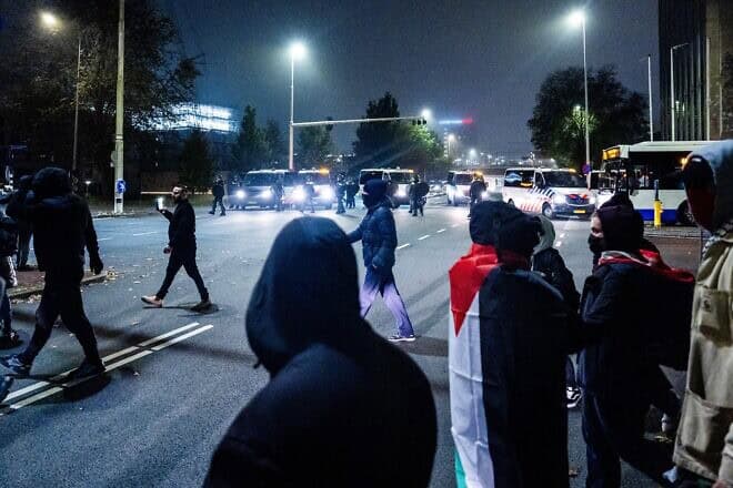 Anti-Israel activists gather on the sidelines of the UEFA Europa League soccer match between Ajax Amsterdam and Maccabi Tel Aviv to commit violence against Jews in Amsterdam, Nov. 7, 2024. Photo by Jeroen Jumelet/ANP/AFP via Getty Images.