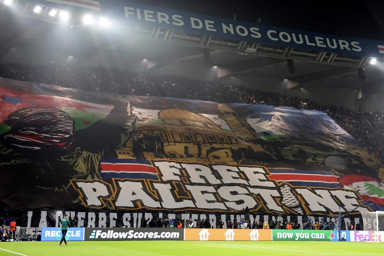 Ultra fans of Paris Saint-Germain unroll a "Free Palestine" banner during the UEFA Champions League 2024/25 League Phase MD4 match between Paris Saint-Germain and Atletico de Madrid at Parc des Princes on Nov. 06, 2024 in Paris, France. Photo by Xavier Laine/Getty Images.