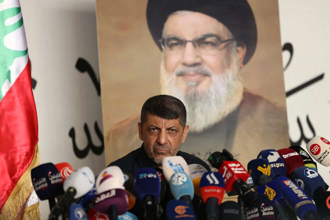 Hezbollah propaganda chief Mohammad Afif speaks in front of a portrait of slain Hezbollah leader Hassan Nasrallah during a press conference in southern Beirut, Nov. 11, 2024. Photo by Anwar Amro/AFP via Getty Images.