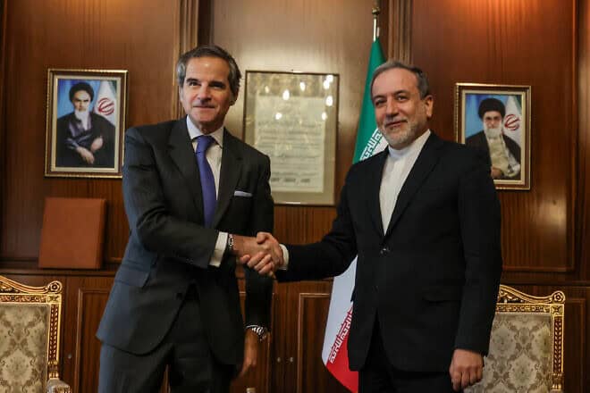 Iranian Foreign Minister Abbas Araghchi shakes hands with International Atomic Energy Agency Director Rafael Grossi before a meeting in Tehran, November 14, 2024. Photo by Atta Kenare/AFP via Getty Images.