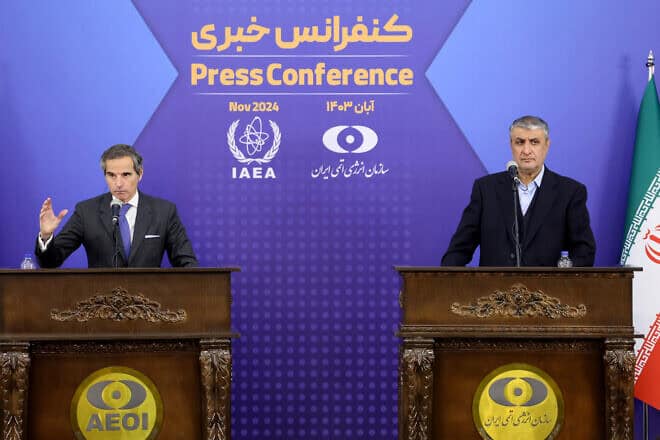 Iran's head of the Atomic Energy Organization Mohammad Eslami (right) and the United Nations nuclear chief Rafael Grossi give a joint press conference in Tehran on Nov. 14, 2024. Photo by Atta Kenare/AFP via Getty Images.