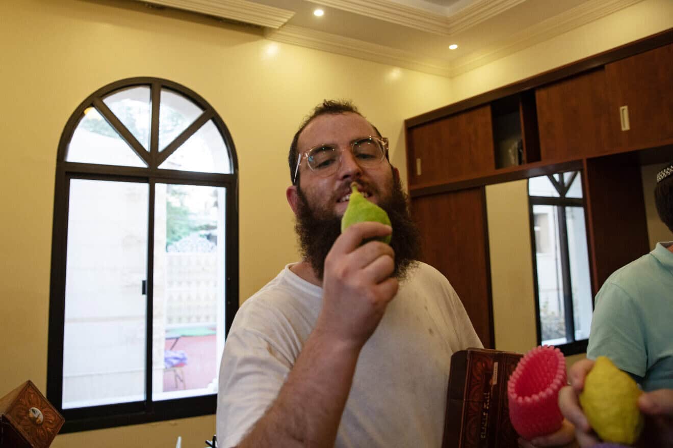 Rabbi Zvi Kogan holds an etrog during the celebration of Sukkot in Dubai, Sept. 20, 2021. Photo by Andrea DiCenzo/Getty Images.