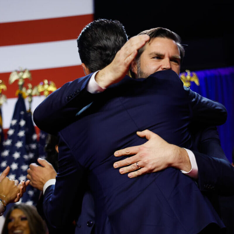 U.S. Vice President-elect J.D. Vance hugs Donald Trump Jr. during an election night event at the Palm Beach Convention Center in Florida on Nov. 6, 2024. Photo by Chip Somodevilla/Getty Images.
