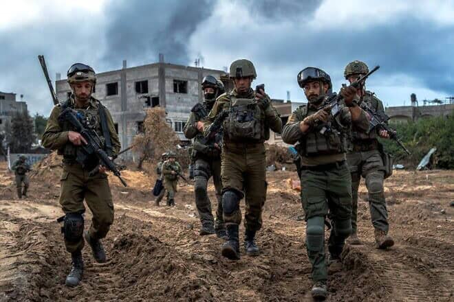 Brig. Gen. Itzik Cohen (center), commander of the IDF's 162nd Division, walks with other officers in Jabalia, the northern Gaza Strip, December 2023. Credit: IDF.