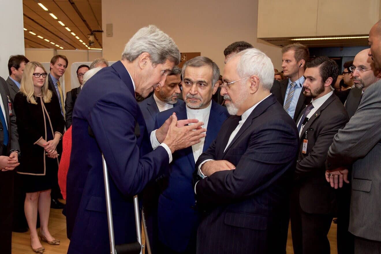 U.S. Secretary of State John Kerry speaks with Hossein Fereydoun (center), the brother of Iranian President Hassan Rouhani, and Iranian Foreign Minister Javad Zarif, before they addressed an international press corps gathered at the Austria Center in Vienna after the European Union, United States, and the rest of its P5+1 partners reached agreement on a plan to prevent Iran from obtaining a nuclear weapon in exchange for sanctions relief, July 14, 2015. Credit: U.S. State Department Photo/Public Domain.