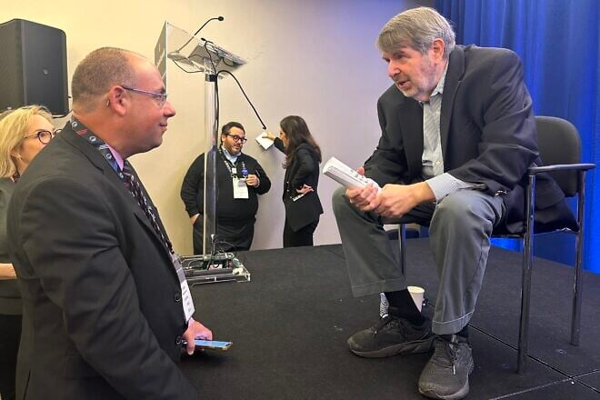 Mike Wagenheim, of JNS, interviews the pro-Israel Democratic strategist and pollster Mark Mellman at the Jewish Federations of North America's General Assembly in Washington, D.C., Nov. 11, 2024. Photo by Menachem Wecker.