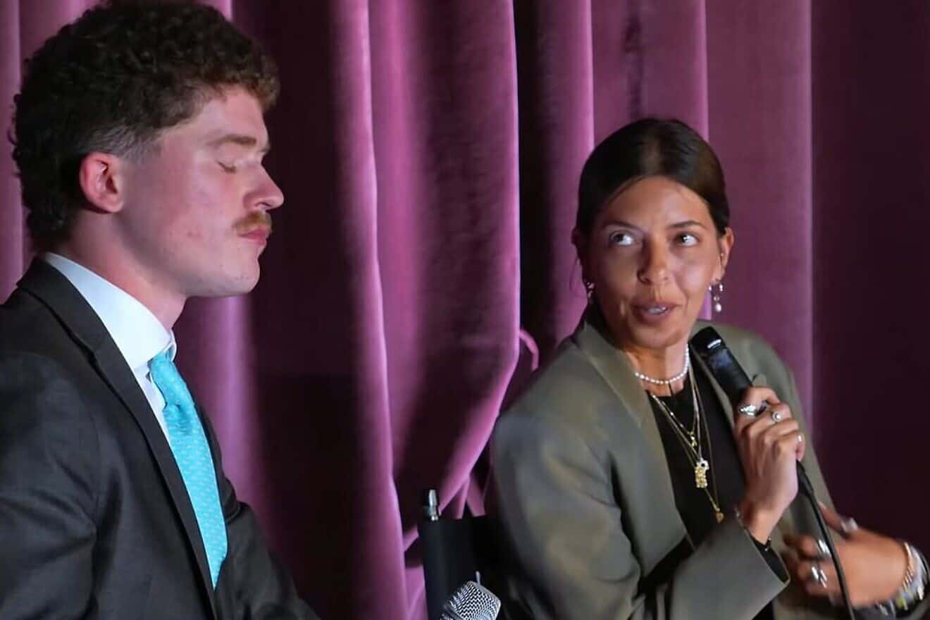 Anti-Israel activist Aiden Doyle (left) and former Hamas captive Moran Stella Yanai at the debate at UCLA. Credit: TCC/X.