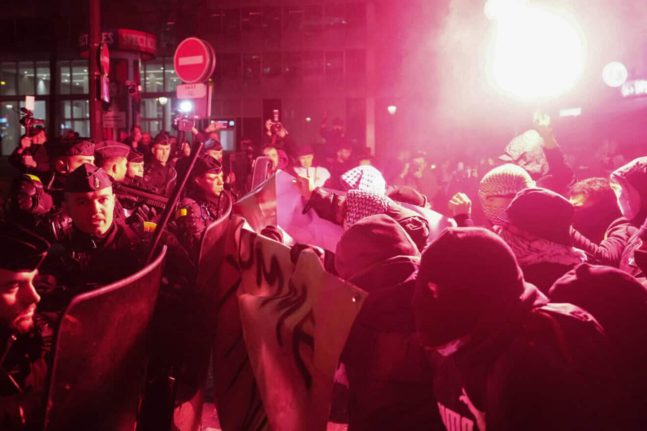Rioters clash with gendarmes during a rally in Paris organized by the France Unbowed, Ecologists—EELV and New Anticapitalist parties against the "Israel is Forever" gala, on Nov. 13, 2024. Photo by Dimitar Dilkoff/AFP via Getty Images.