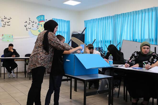A woman casts her ballot at a voting station in Tayibe, in the Triangle region, during the Knesset election on Nov. 1, 2022. Photo by Jamal Awad/Flash90.
