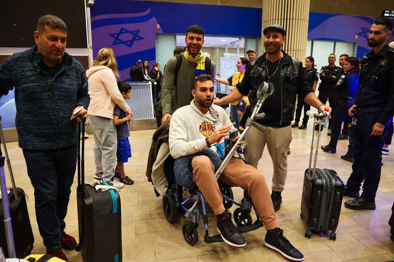 Maccabi Tel Aviv fans arrive at Ben-Gurion International Airport after an El Al emergency flight from Amsterdam on Nov. 8, 2024. Photo by Jonathan Shaul/Flash90.