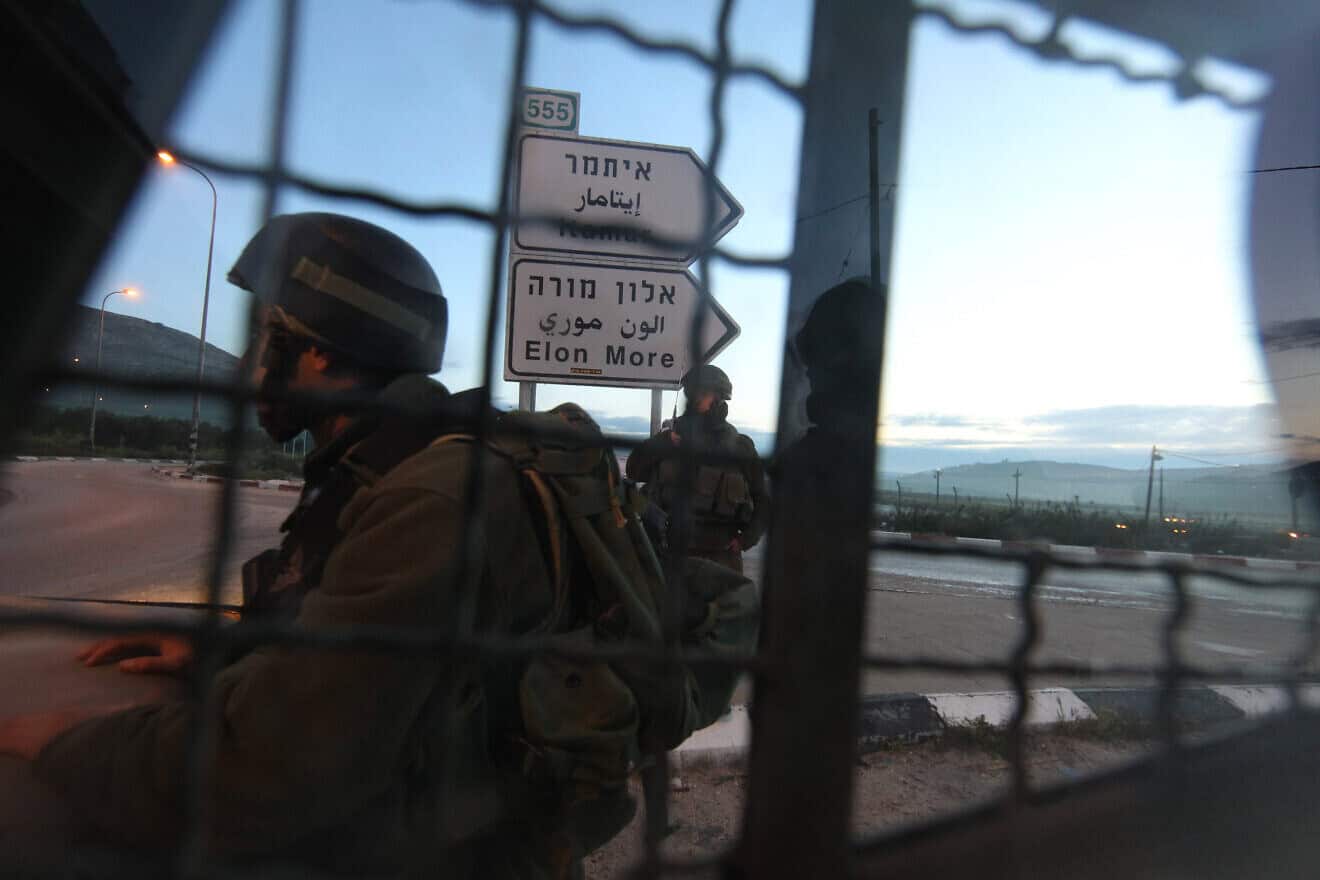 Israeli soldiers block a road near Huwara, south of the Samaria city of Nablus (Shechem), March 12, 2011. Photo by Nati Shohat/Flash90.