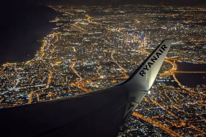 Wing of a Ryanair airliner at night over the city of Tel Aviv after taking off from Ben Gurion Airport, Sept. 9, 2022. Credit: Davidi Vardi via Wikimedia Commons.
