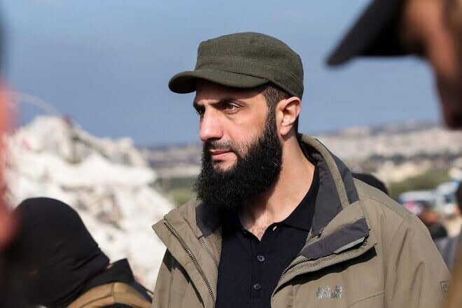 Hayat Tahrir al-Sham chief Abu Mohammad al-Julani checks the damage following an earthquake in Besnaya, in Syria's rebel-held northwestern Idlib Province at the border with Turkey, on Feb. 7, 2023. Photo by Omar Haj Kadour/AFP via Getty Images.