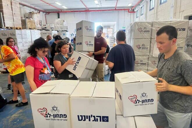 Volunteers from abroad help with manifold needs in Israel while it fights Hamas to the south and Hezbollah to the north, one of many programs associated with Birthright Israel. Credit: Courtesy of Birthright Israel.