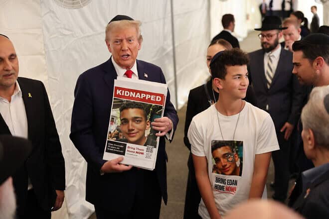 Presidential candidate Donald Trump with the family of hostage Edan Alexander at the Ohel in Queens, N.Y., the resting place of Rabbi Menachem Mendel Schneerson, on the first anniversary of the Hamas-led invasion of the Negev, Oct. 7, 2024. Photo by Michael M. Santiago/Getty Images.