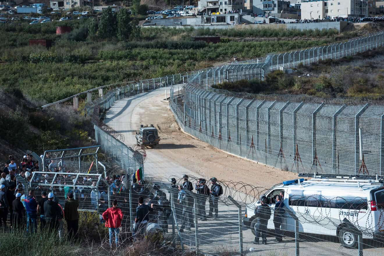 Israeli Druze gather at the Israeli-Syrian border in the Golan Heights to support Syrian Druze in the village of Hadar, Oct. 3, 2017. Photo by Basel Awidat/Flash90.
