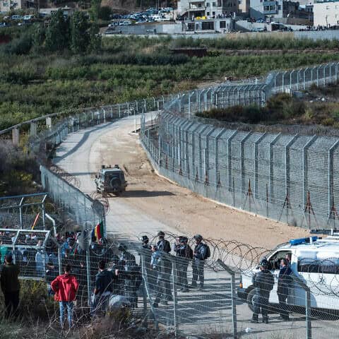 Israeli Druze gather at the Israeli-Syrian border in the Golan Heights to support Syrian Druze in the village of Hadar, Oct. 3, 2017. Photo by Basel Awidat/Flash90.