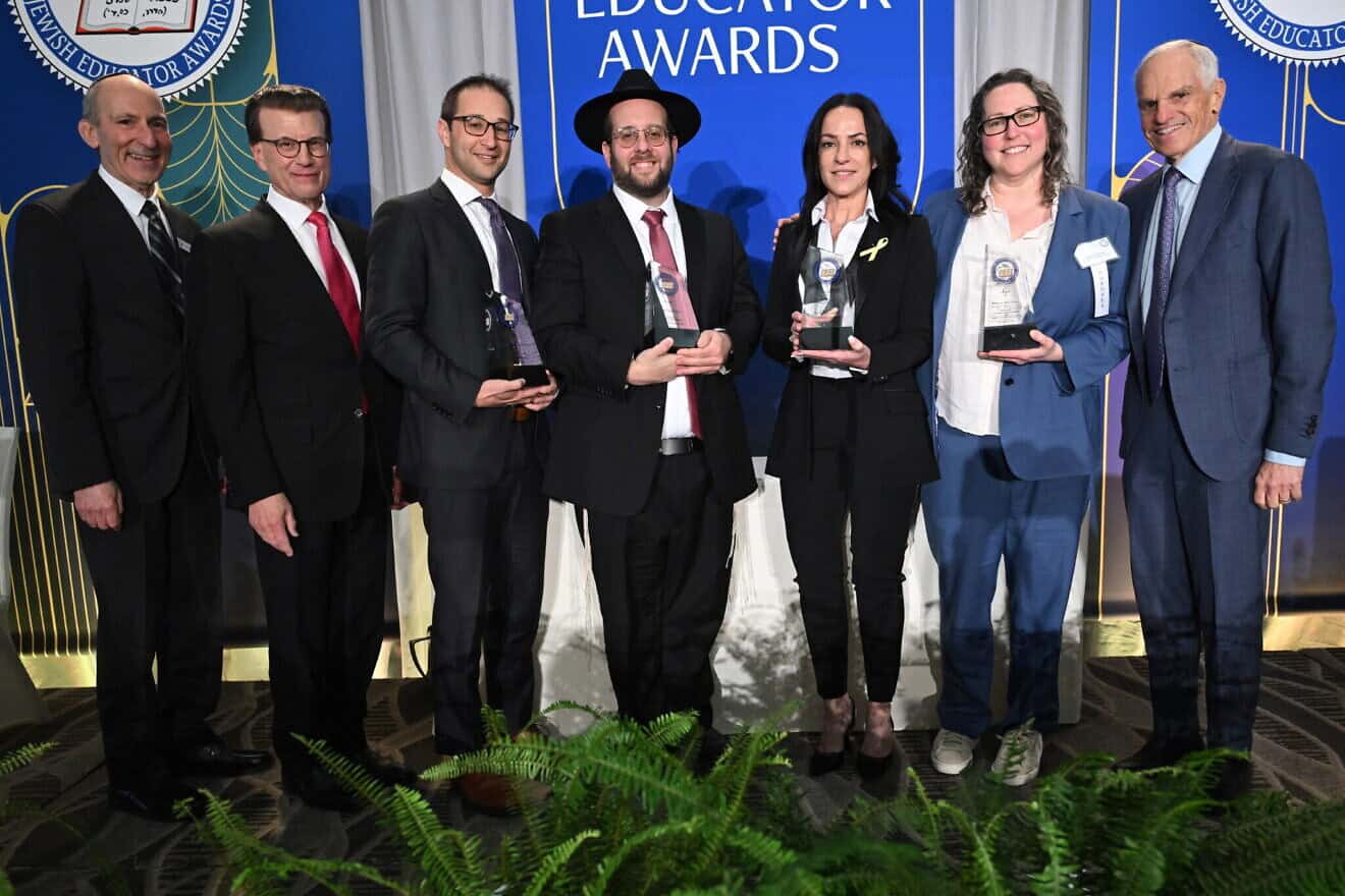 The four winners—in center from left, Rabbi Ari Schwarzberg, Rabbi Yossi Elefant, Einav Telem and Rebecca Moray—of the 34th annual Jewish Educator Awards, given at a luncheon in Los Angeles on Dec. 10, 2024. Credit: Courtesy of the Milken Family Foundation.