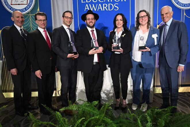 The four winners—in center from left, Rabbi Ari Schwarzberg, Rabbi Yossi Elefant, Einav Telem and Rebecca Moray—of the 34th annual Jewish Educator Awards, given at a luncheon in Los Angeles on Dec. 10, 2024. Credit: Courtesy of the Milken Family Foundation.