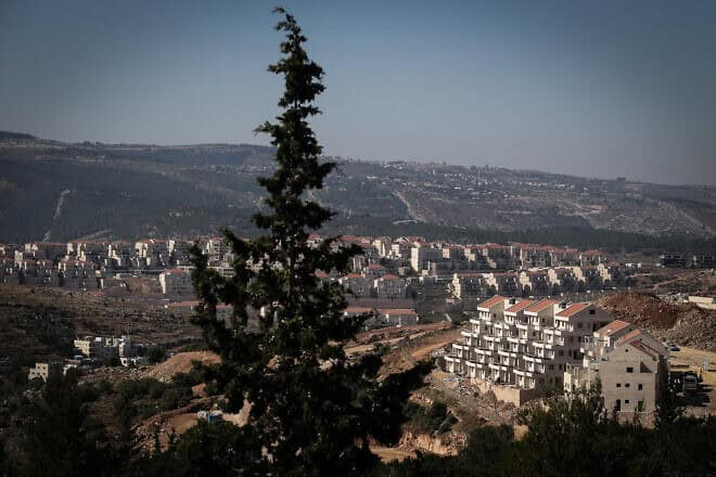 New construction in Tzur Hadassah, 7.5 miles southwest of Jerusalem, with the ultra-Orthodox city of Beitar Illit in the background and across the Green Line, June 17, 2015. Photo by Nati Shohat/Flash90.