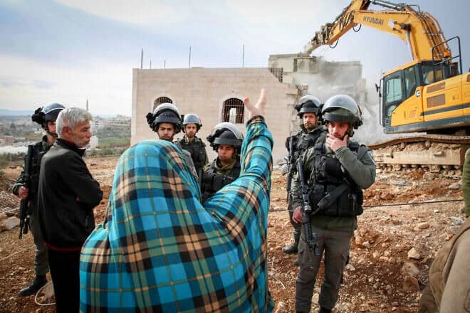 The demolition of an illegally built structure in the Judea city of Hebron, Dec. 28, 2021. Photo by Wisam Hashlamoun/Flash90.