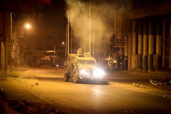 Palestinian rioters clash with Israeli soldiers near Joseph's Tomb in Nablus, Samaria, as thousands of Jews visit the grave during Sukkot, Oct. 5, 2023. Photo by Nasser Ishtayeh/Flash90.