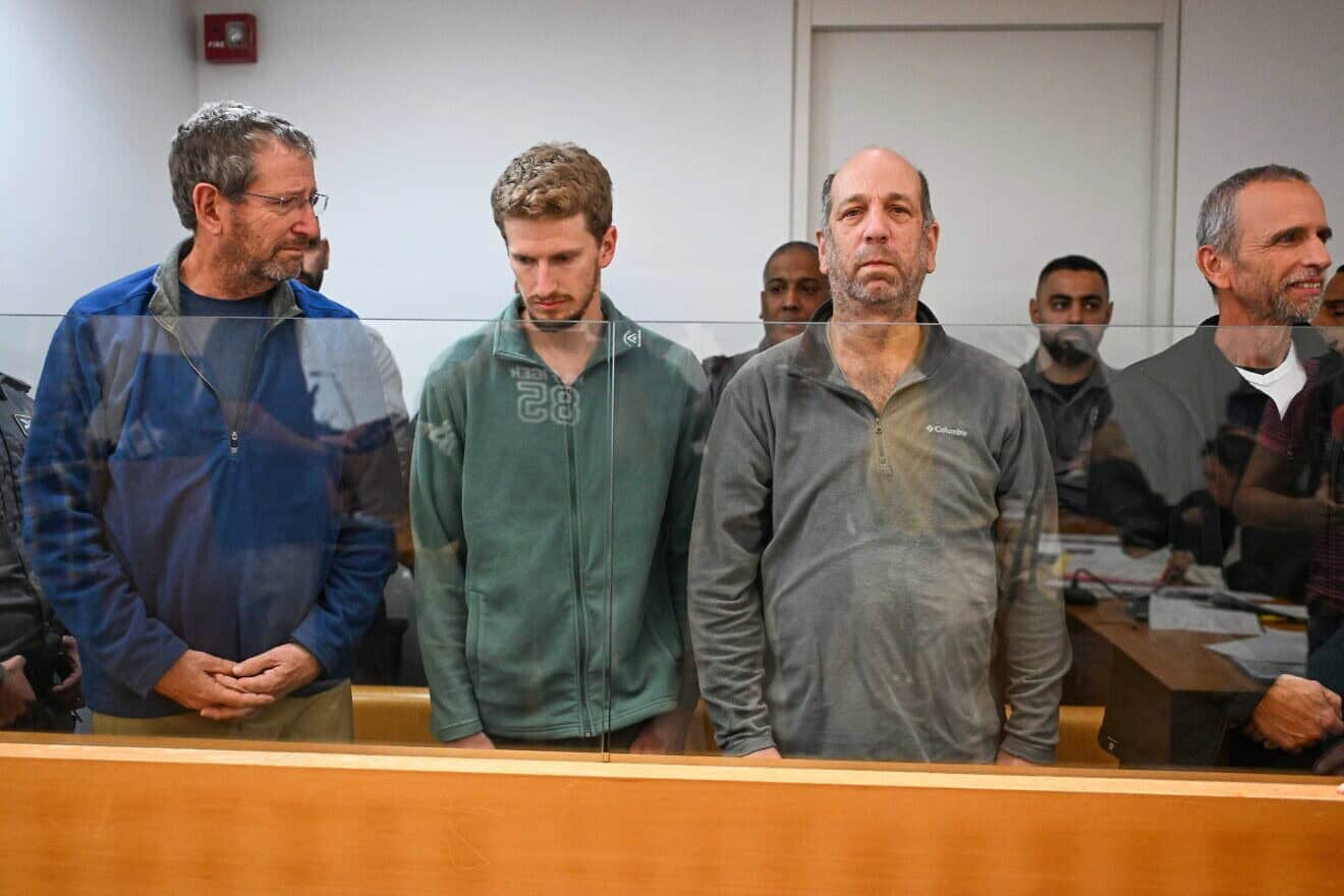 Four men, including Rear Adm. (res.) Ofer Doron (left), accused of firing flares at Prime Minister Benjamin Netanyahu's private residence in Caesarea, arrive for a hearing at the Haifa District Court on Dec. 2, 2024. Credit: Flash90.