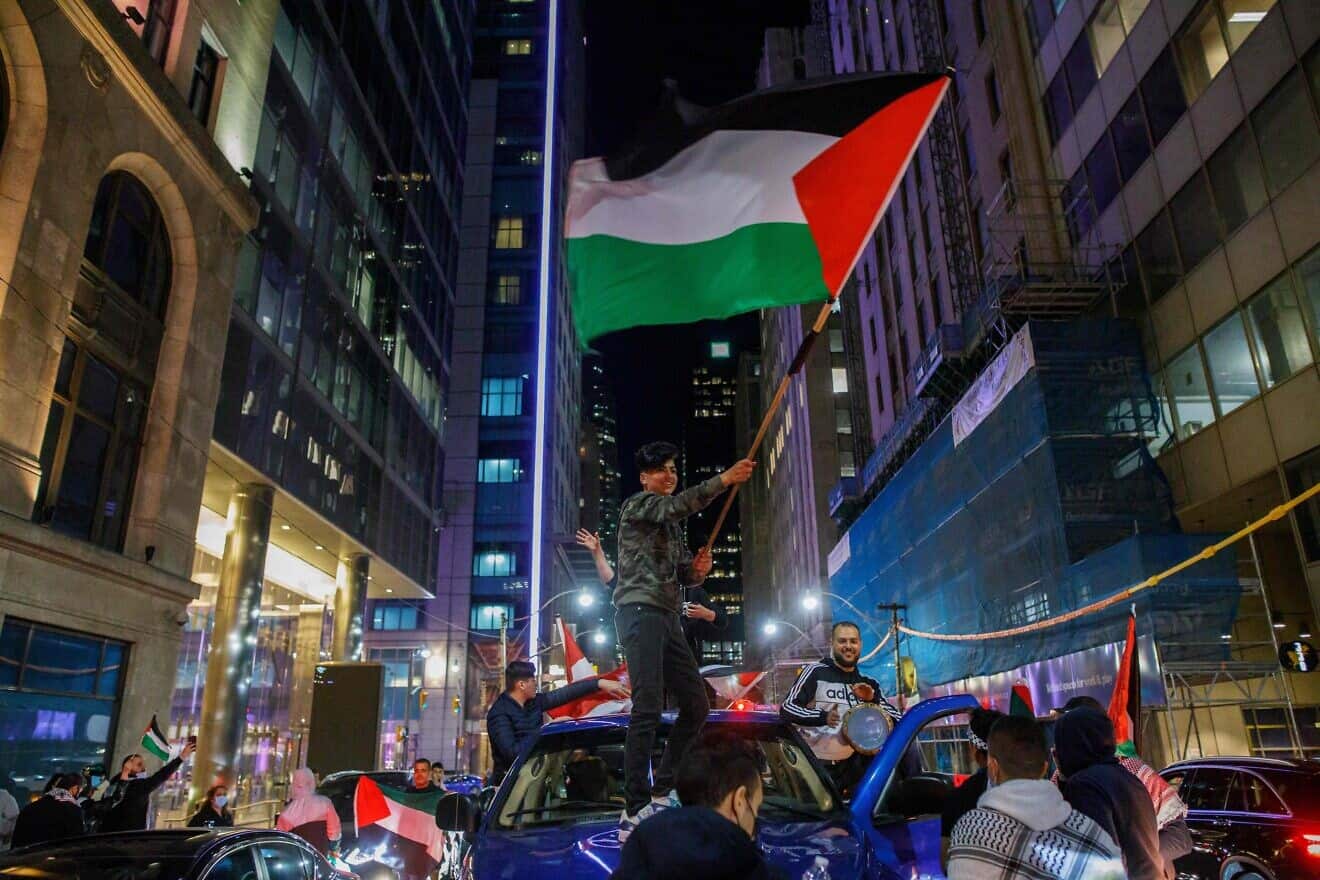 People wave PLO flags atop cars during an anti-Israel protest at Toronto City Hall, May 15, 2021. Photo by Cole Burston/AFP via Getty Images.