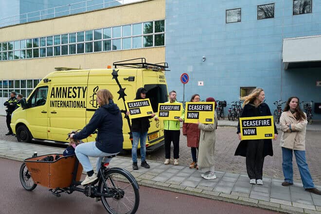 Amnesty International activists protest outside the Israeli embassy in The Hague, the Netherlands, May 8, 2024. Photo by Pierre Crom/Getty Images.