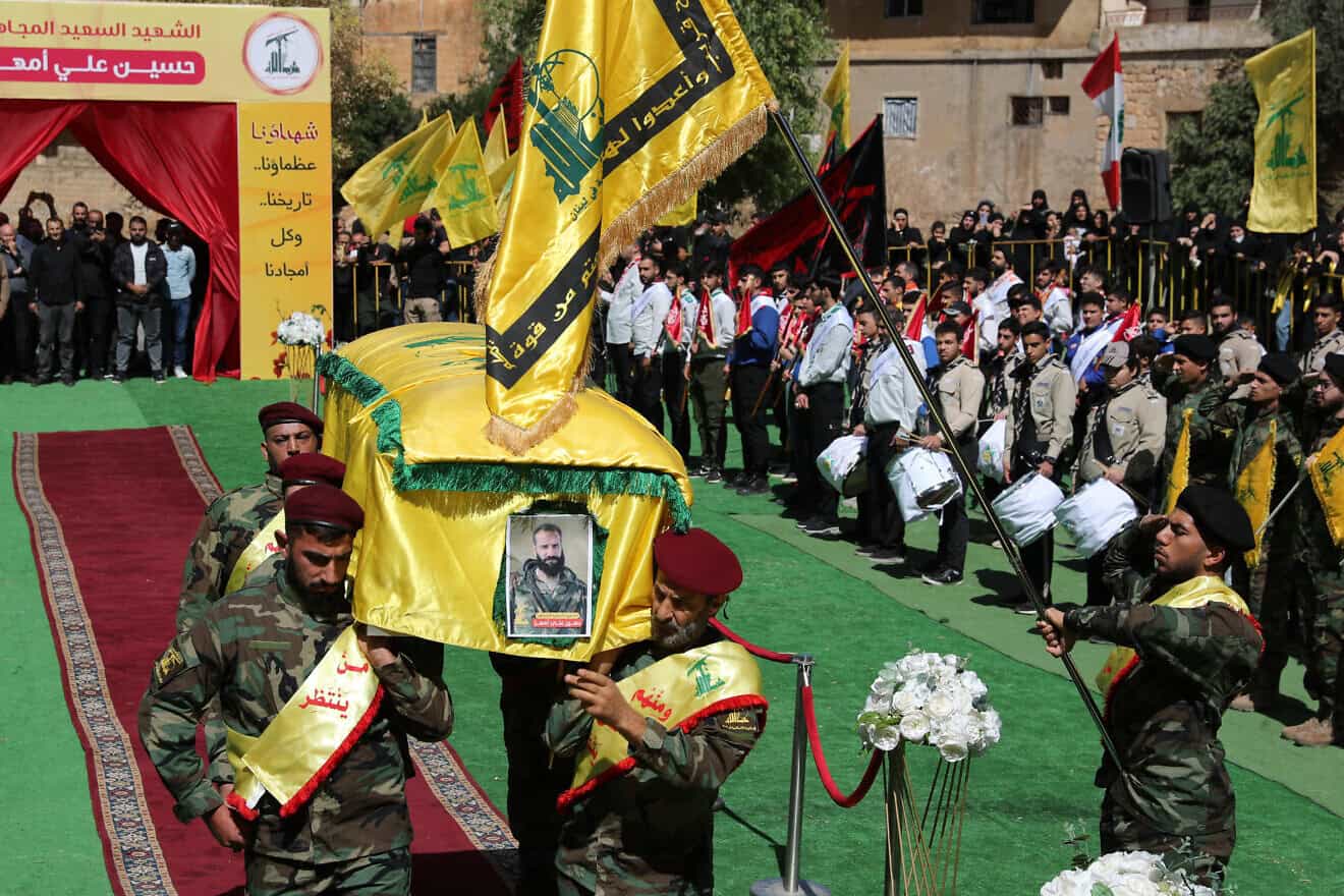 Hezbollah in Lebanon carry the coffin of slain member Hussein Amhaz during his funeral in Baalbek, in Lebanon's Bekaa Valley, on Sept. 19, 2024. Hundreds of pagers and walkie-talkies used by Hezbollah exploded across Lebanon in unprecedented attacks that spanned two days, killing 32 people and wounding more than 3,000 others. Photo by AFP via Getty Images.
