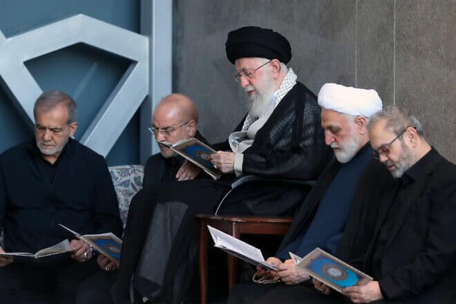 Iran's leader, Ali Khamenei (center), is seen alongside Iranian President Masoud Pezeshkian (left), Parliament Speaker Mohammad Bagher Ghalibaf (second left), Judiciary Chief Mohsen Ejeie (second right) and Hezbollah representative in Iran Abdallah Safieddine reading the Koran during Friday prayers in Tehran, Oct. 4, 2024. Credit: Iranian Leader's Press Office.