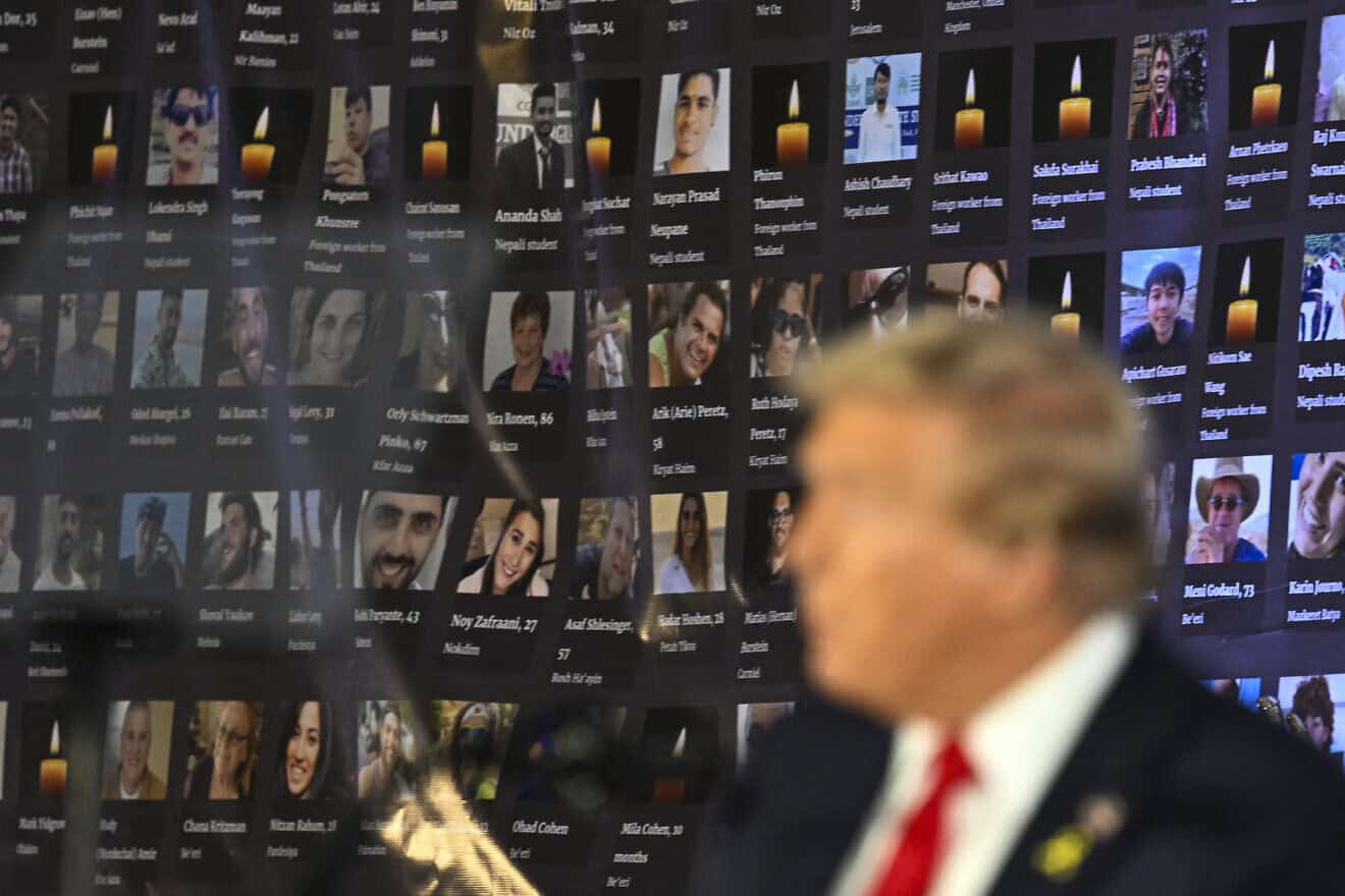 Pictures of hostages and victims are seen by then-Republican presidential candidate and former president Donald Trump during a remembrance event to mark the first anniversary of the Hamas attack on Israel at Trump National Doral golf club in Miami on Oct. 7, 2024. Photo by Chandan Khanna/AFP via Getty Images.