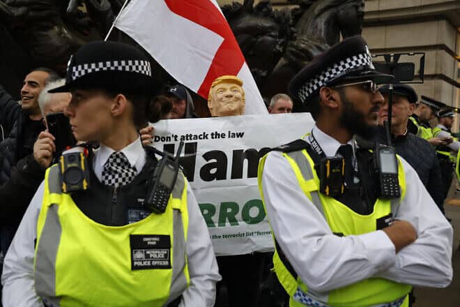Police separate a group of counter-protesters from the main march during a national demonstration for Palestine and Lebanon, in central London, on Nov. 30, 2024. Photo by Carlos Jasso /AFP via Getty Images.