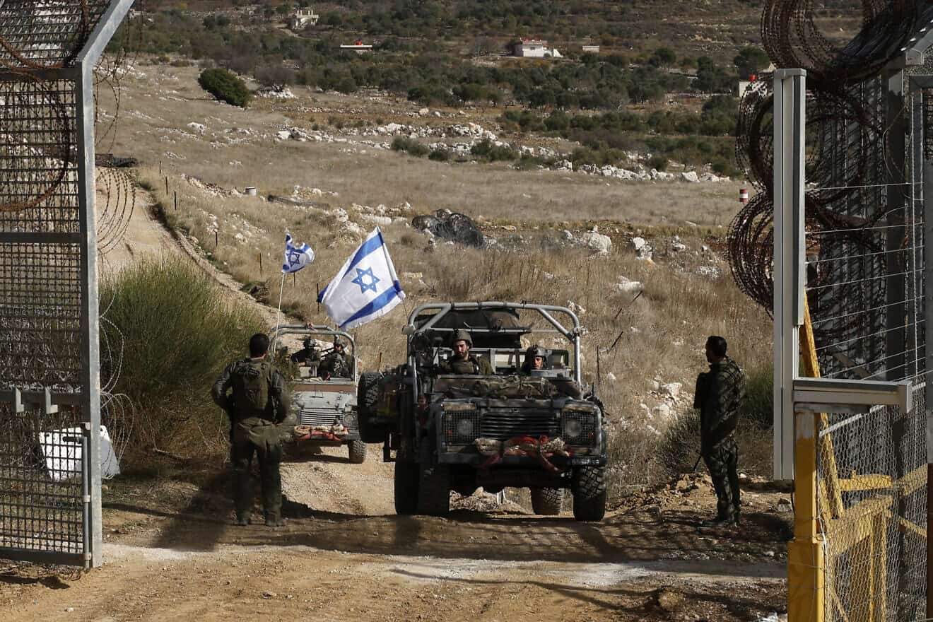 IDF vehicles return from the buffer zone with Syria, near the Druze village of Majdal Shams in the Golan Heights on Dec. 10, 2024. Photo by Jalaa Marey/AFP via Getty Images.