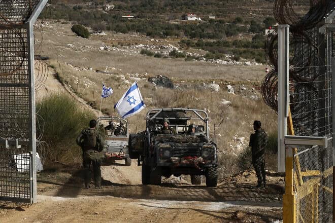 IDF vehicles return from the buffer zone with Syria, near the Druze village of Majdal Shams in the Golan Heights on Dec. 10, 2024. Photo by Jalaa Marey/AFP via Getty Images.